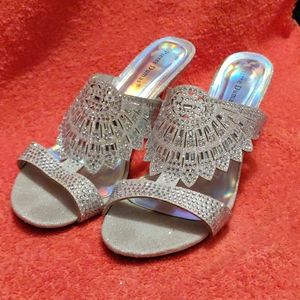 Size 10 silver rhinestone dressy slip on mules.